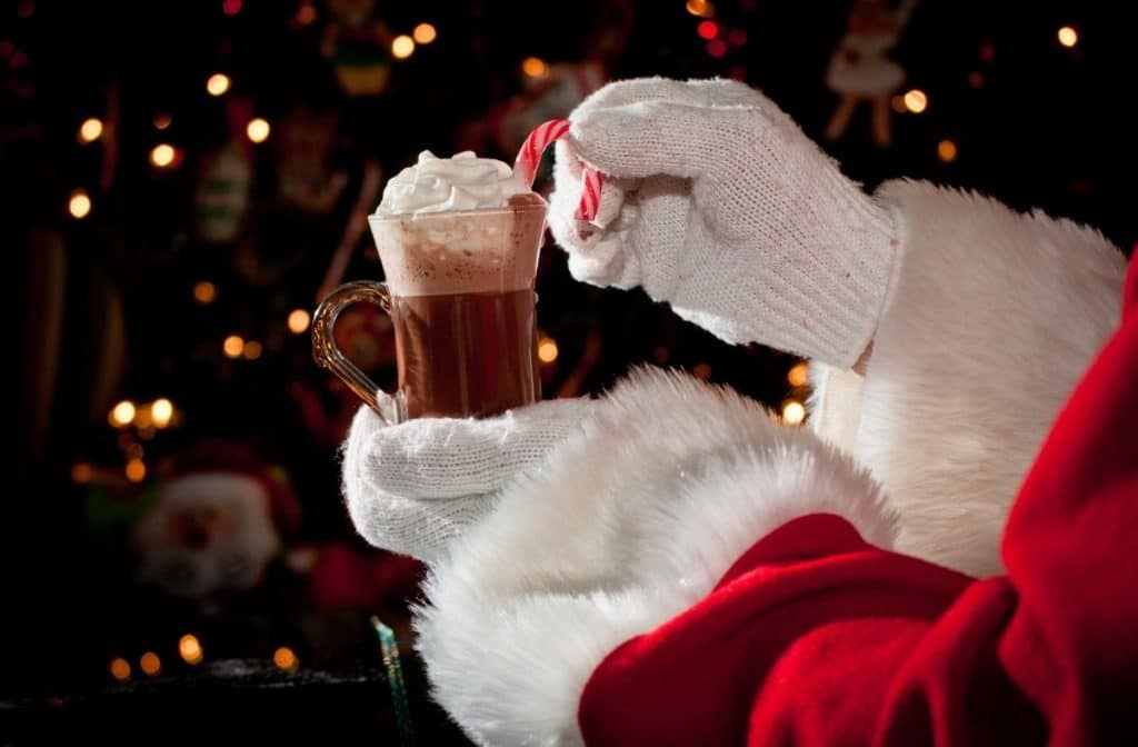 Santa holding Hot Cocoa