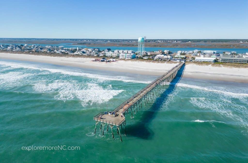 Aerial View of Topsail Beach with pier and water tower in the back