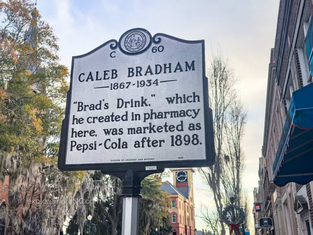 Historical Sign - Caleb Bradham - "Brad's Drink" which he created in pharmacy here, was marketed as Pepsi-Cola after 1898